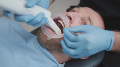Denturist performing digital denture scan
